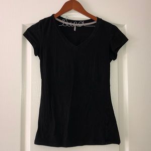 Black short sleeve shirt with a V-neck.